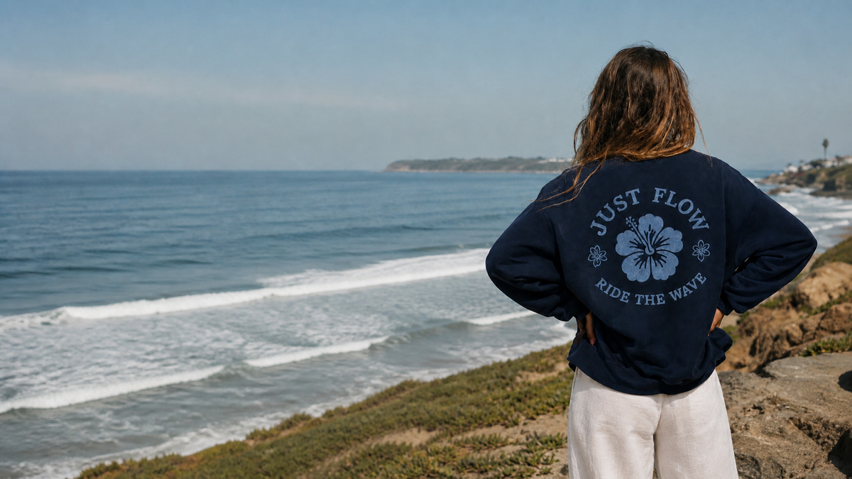 Ride the Wave Crew Sweatshirt on a coastal bluff - Just Flow