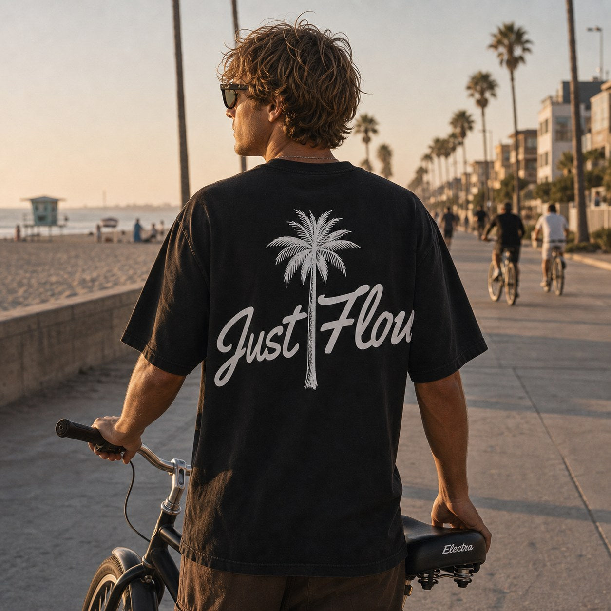 Black palm script tee on the boardwalk