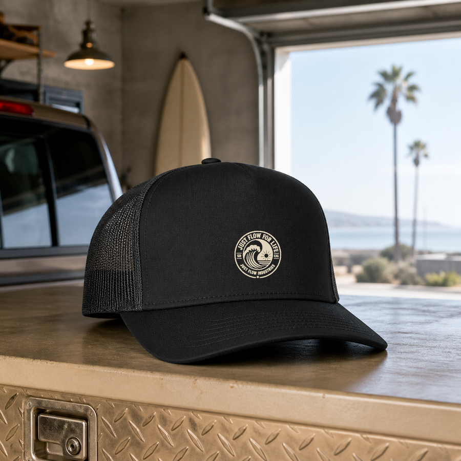 Circular Wave Crest embroidered trucker cap with the cream logo