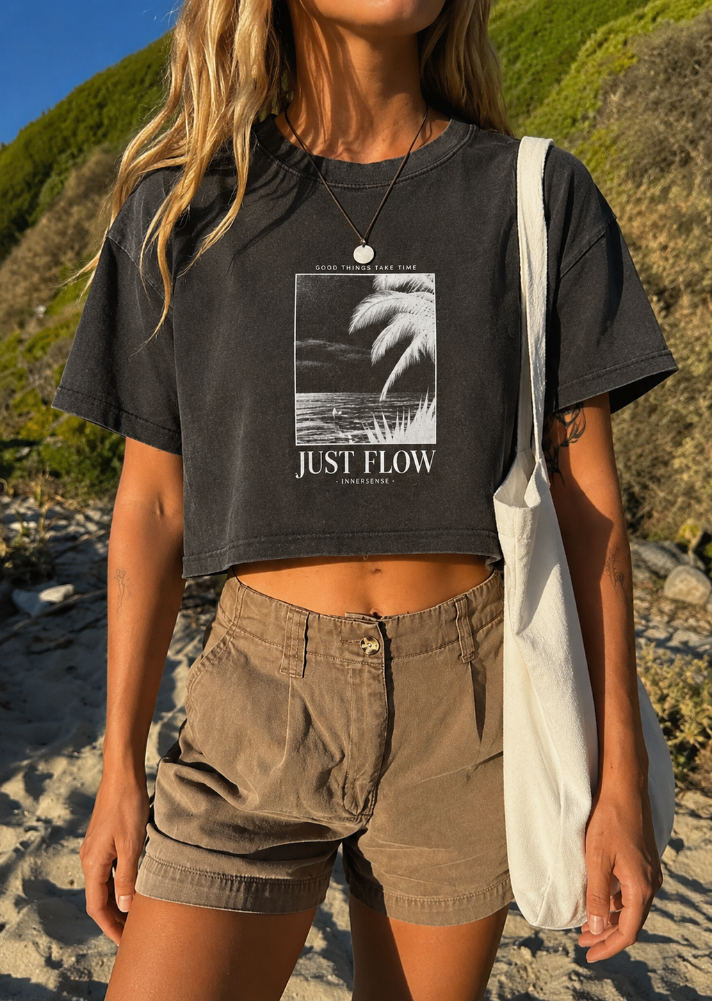 Good Things Cropped Tee in washed black, worn at the beach