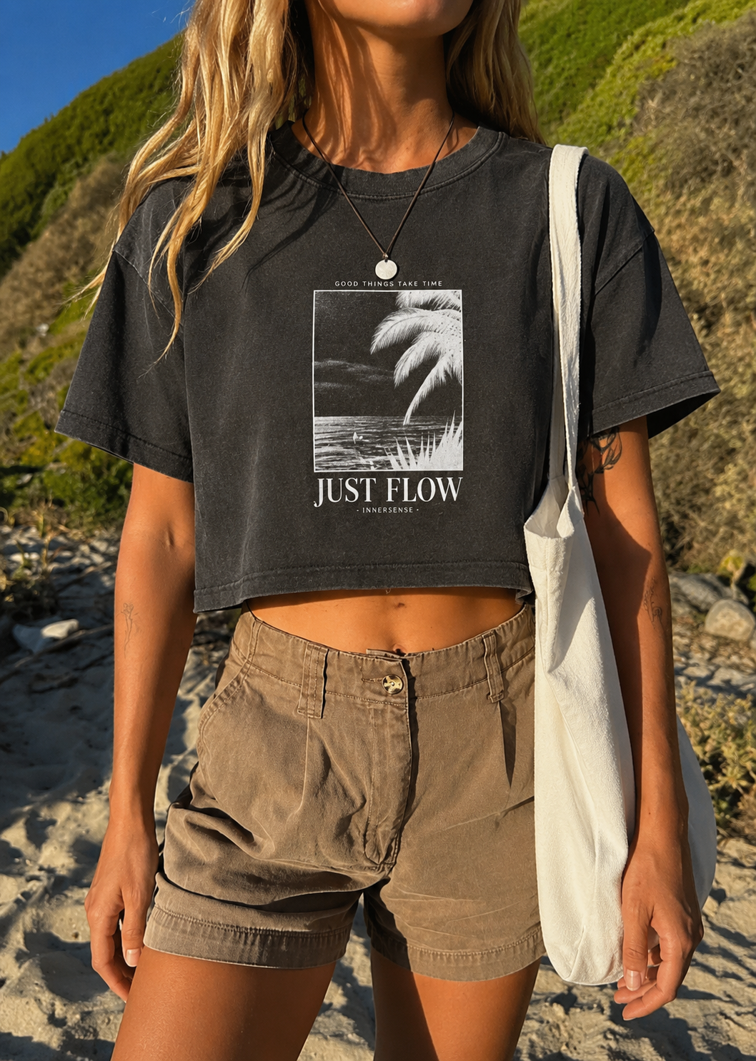 Good Things Cropped Tee in washed black, worn at the beach