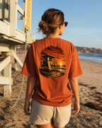Golden Hour Lifeguard Tower heavyweight tee in Burnt orange, back graphic, Southern California boardwalk