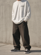 Coastal Long Sleeve Tee in vintage white, concrete wall