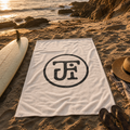 Monogram beach towel on the sand at Windansea cove