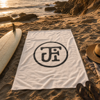 Monogram beach towel on the sand at Windansea cove