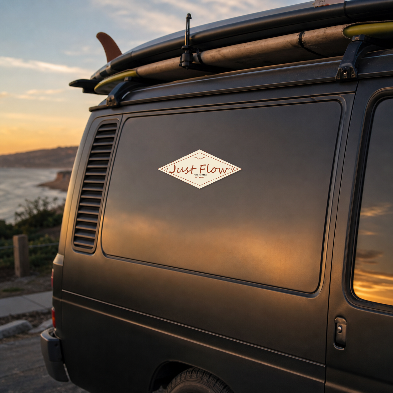 Diamond Badge sticker on a dark charcoal surf van