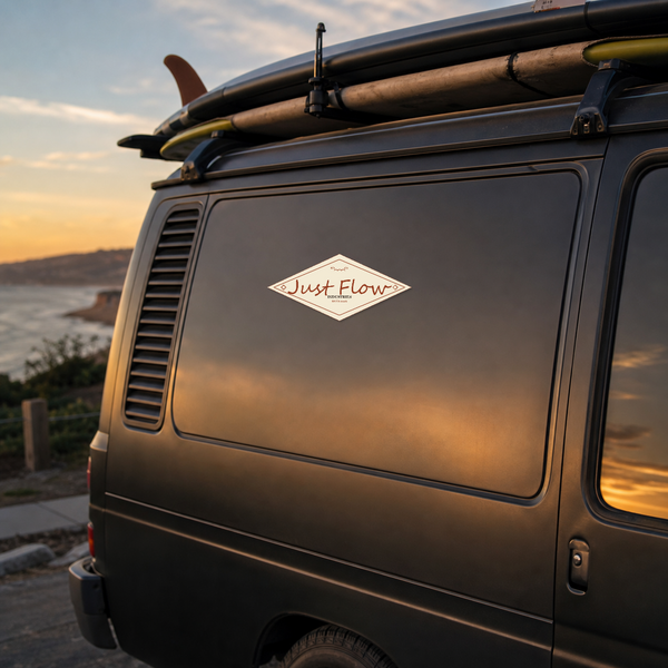 Diamond Badge sticker on a dark charcoal surf van