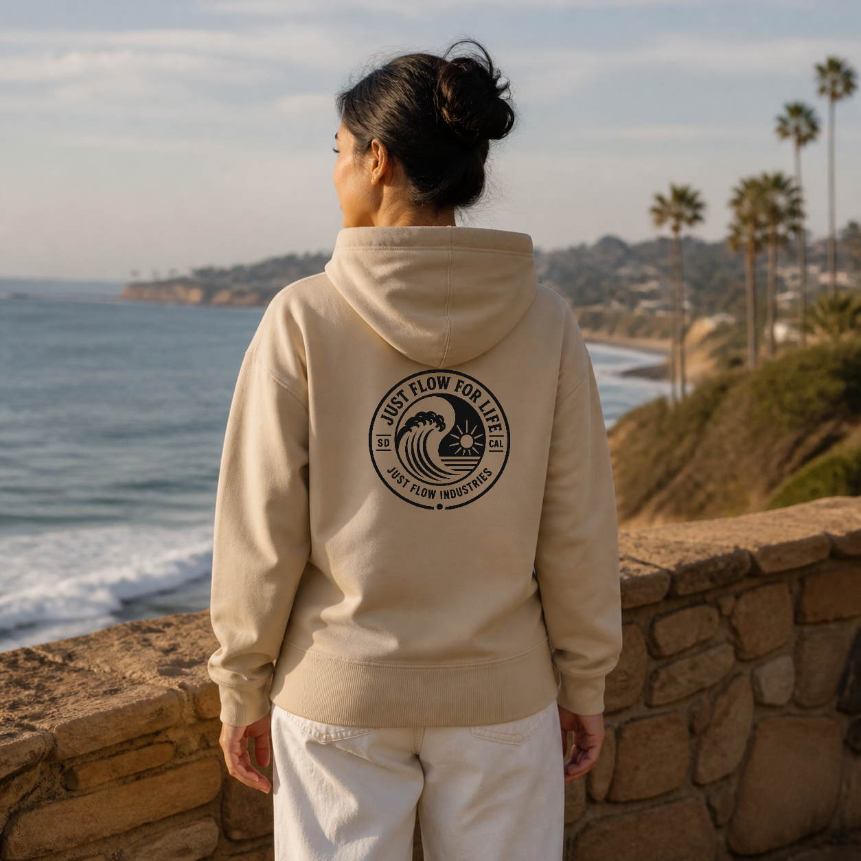 Circular Wave Crest DTF Hoodie with the black crest in Sand, back graphic