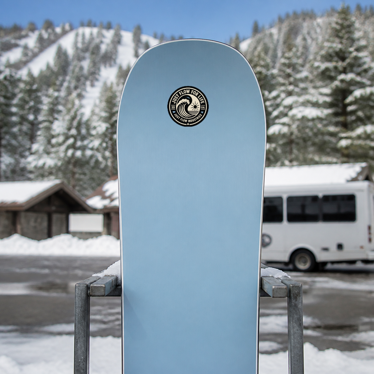 Circular Wave Crest sticker, bone crest on black, on a soft-blue snowboard