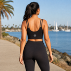 JFI Monogram Sports Bra in black, back view showing the monogram, San Diego waterfront