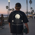 Palm Frequency tee, worn back print on the boardwalk
