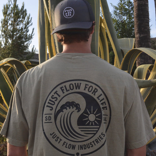 Circular Wave Crest Heavyweight Tee in sage, back print worn in a San Diego agave garden