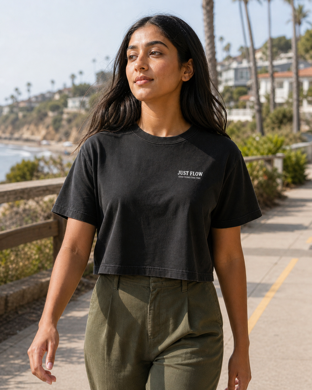 Woman wearing the Minimal Wordmark Cropped Tee on a Southern California coastal path