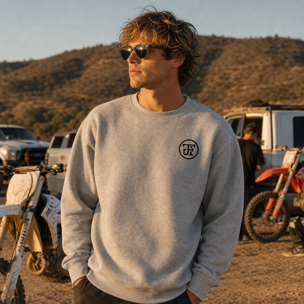 Grey monogram fleece crew at the dirtbike staging area