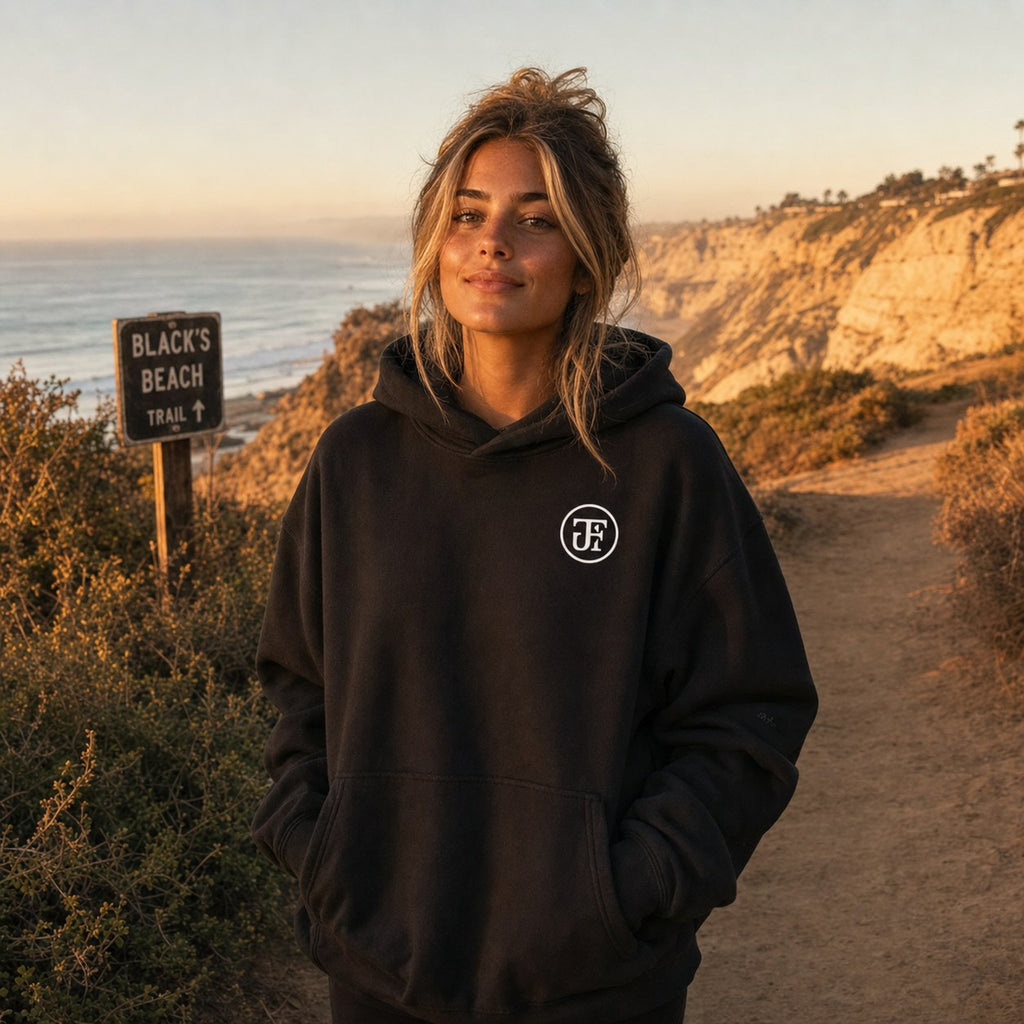 Black monogram hoodie on the Black's Beach trail at golden hour