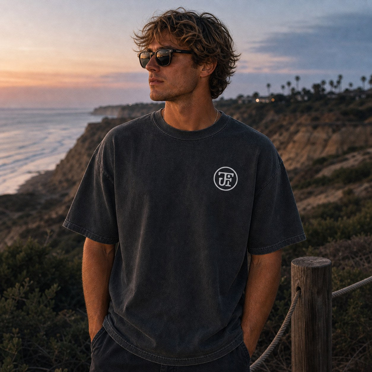 Washed dark monogram tee at the canyon overlook, sunset