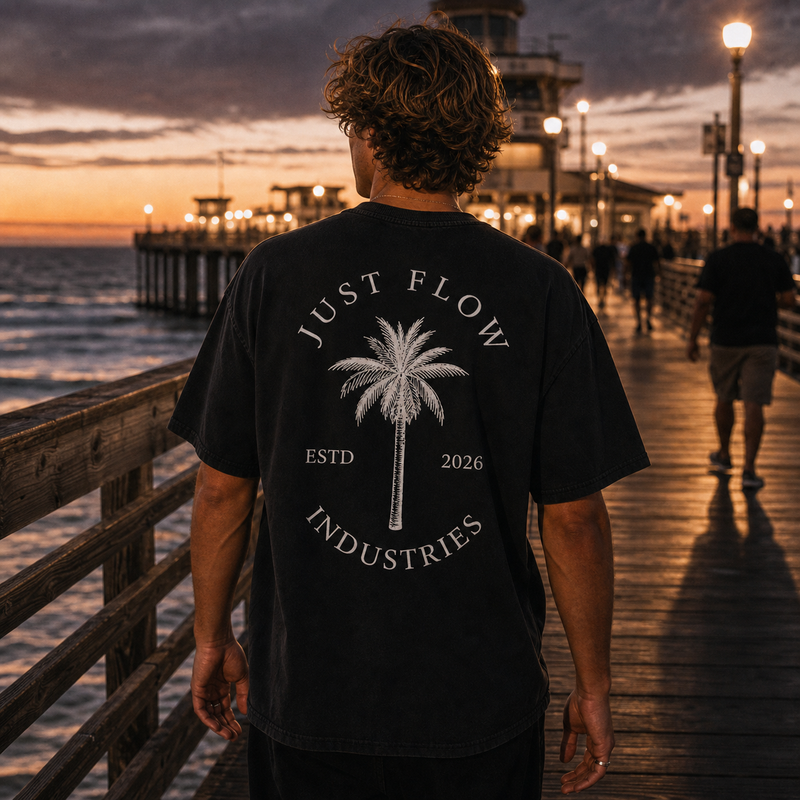Palm Emblem heavyweight tee, back, on the pier at dusk