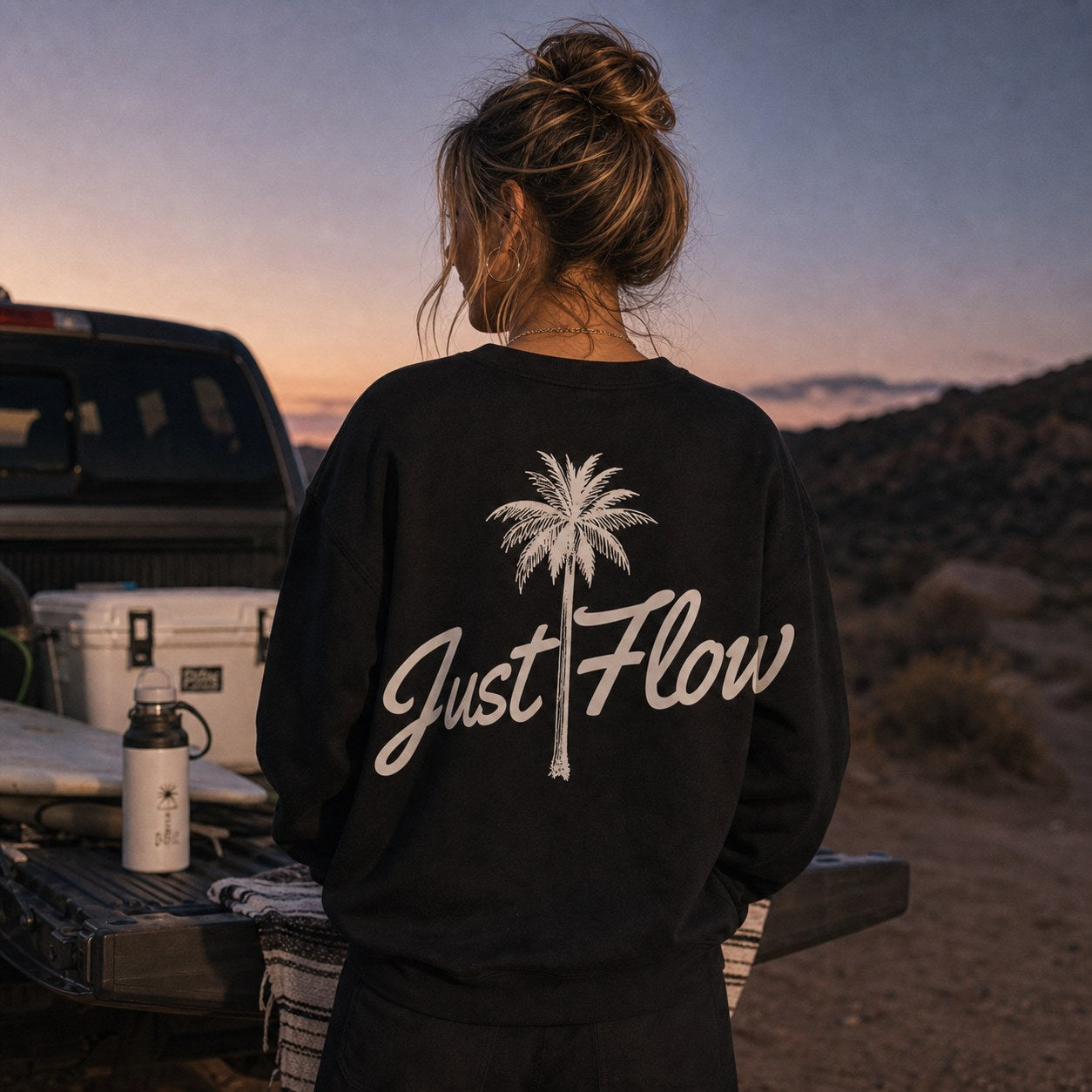 Black palm script fleece crew at a desert tailgate, dusk