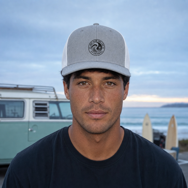 Circular Wave Crest Trucker Cap, black logo, lifestyle (corrected crest)